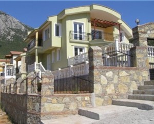 Front view of villa rental in Turkey with the Taurus mountains soaring high above the Uzumlu valley